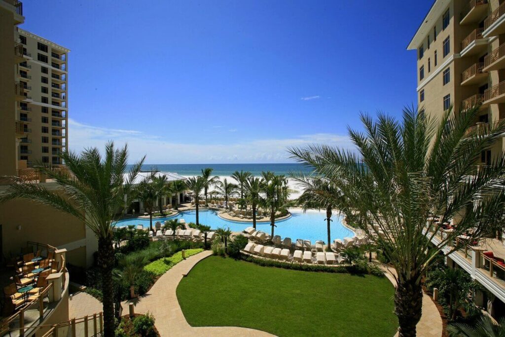 Resort pool complex overlooking the Gulf beach