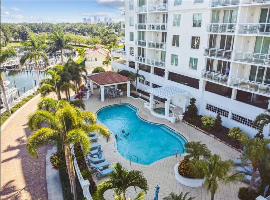 Freeform resort pool in the courtyard of a waterfront condominium