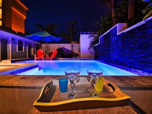 3D rendering of a swimming pool lit up at night