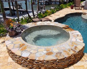 Snell Island custom round-shaped spa added to an inground pool