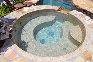 Snell Island custom round-shaped spa added to an inground pool